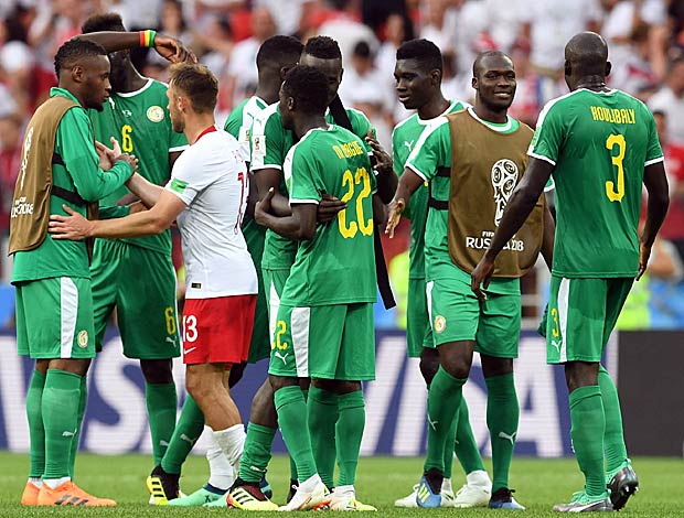 Jogadores do Senegal festejam ap&oacute;s vencerem a Pol&ocirc;nia
