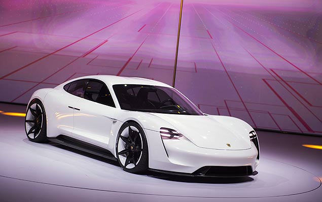 The new electric Porsche Mission E concept car is presented during the Volkswagen group night at the Fraport arena prior to the 66th IAA auto show in Frankfurt am Main, Western Germany, on September 14, 2015. Volkswagen group showed their latest models and automotive concepts from the brands Volkswagen, Audi, Bentley, Bugatti, Ducati, Lamborghini, Porsche, Seat and Skoda. Hundreds of thousands of visitors are expected to crowd into the massive exhibition halls of Frankfurt's sprawling trade fair grounds later this week to catch a glimpse of the latest models and high tech innovations. AFP PHOTO / ODD ANDERSEN ORG XMIT: ODD621