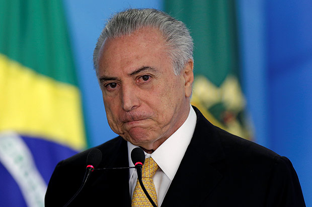 Brazil's interim President Michel Temer reacts during ceremony for the new rules of the program 