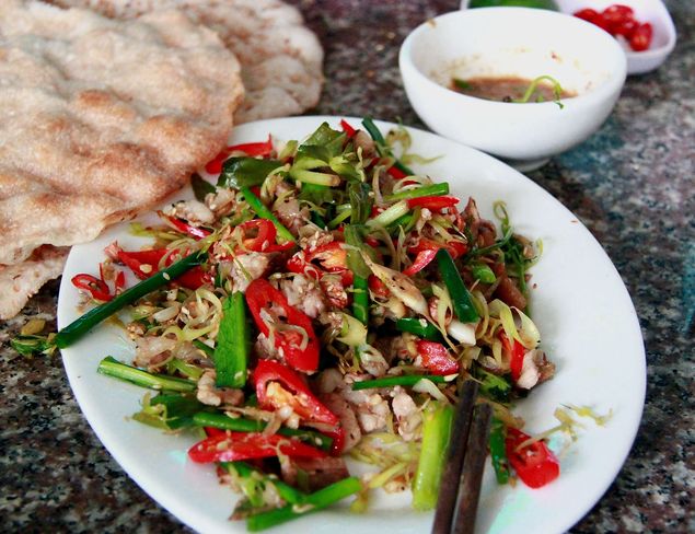 TO GO WITH STORY VIETNAM-FOODS-ANIMALS, FEATURE BY CAT BARTON This picture taken on June 19, 2014 shows a dish prepared with cat meat at a restaurant in Hanoi. The enduring popularity of 