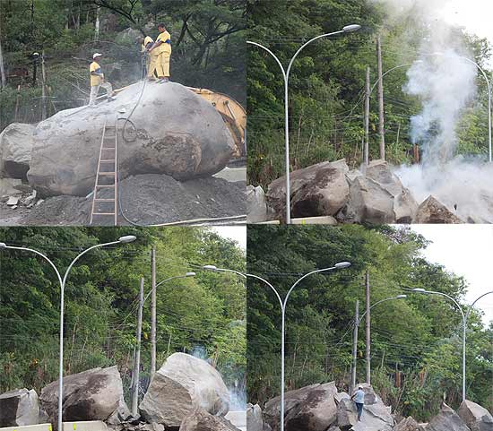 Funcionrios usam explosivos para retirar pedra que deslizou e bloqueia a estrada Graja-Jacarepagu, no Rio