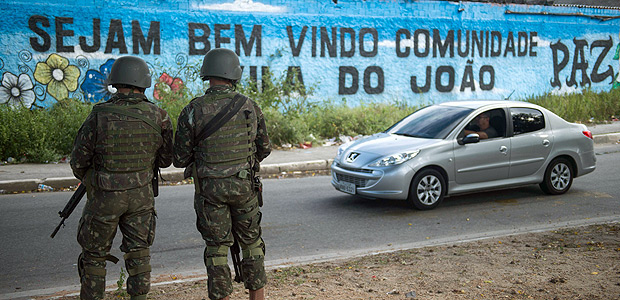 Military troops patrol Vila do Joao shantytown in Rio de Janeiro