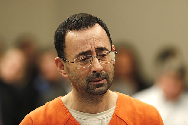Dr. Larry Nassar appears in court for a plea hearing in Lansing, Mich., Wednesday, Nov. 22, 2017. Nasser, a sports doctor accused of molesting girls while working for USA Gymnastics and Michigan State University, pleaded guilty to multiple charges of sexual assault and will face at least 25 years in prison. (AP Photo/Paul Sancya) ORG XMIT: MIPS101
