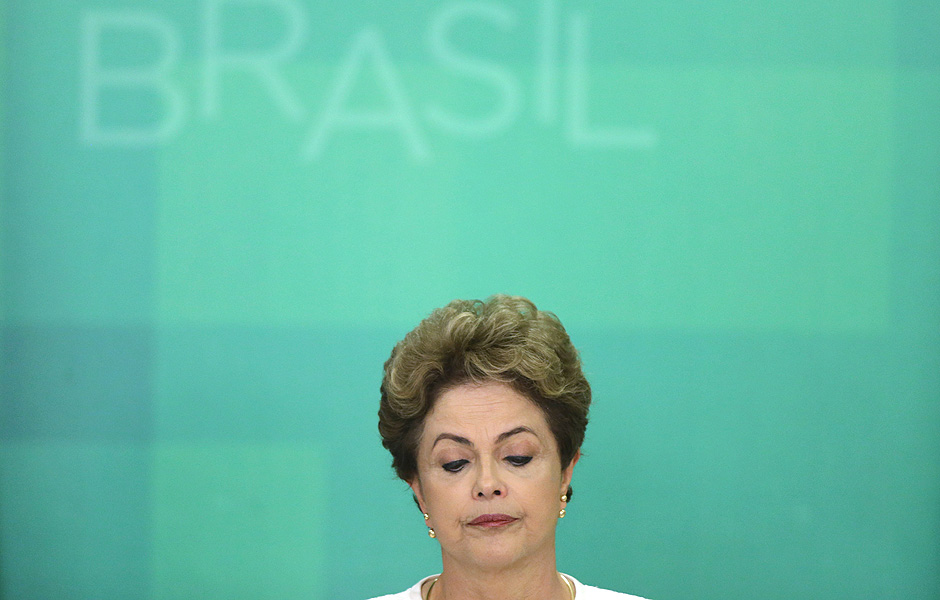 Brazil's President Dilma Rousseff looks down during a press conference after impeachment proceedings were opened against her by the President of Chamber of Deputies Eduardo Cunha, at the Planalto Presidential Palace in Brasilia, Brazil, Wednesday, Dec. 2, 2015. The speaker of the nation's lower house says he's opening the impeachment process based on accusations that Rousseff's government broke fiscal responsibility laws this year. (AP Photo/Eraldo Peres) ORG XMIT: ERA103 --- "CHAMADA CAMINHO IMPEACHMENT"
