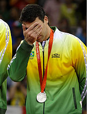 Marcelo Elgarten of Brazil reacts during the medal ceremony after the men's final volleyball match against the U.S. at the Beijing 2008 Olympic Games, August 24, 2008. Brazil finished second. REUTERS/Alexander Demianchuk (CHINA)
