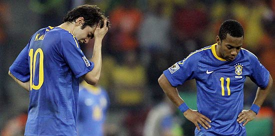 Brazil's Kaka, left, and teammate Robinho react after Netherlands' Wesley Sneijder scored a goal during the World Cup quarterfinal soccer match between the Netherlands and Brazil at Nelson Mandela Bay Stadium in Port Elizabeth, South Africa, Friday, July 2, 2010. (AP Photo/Matt Dunham)