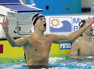 Cesar Cielo of Brazil jubiulates after winning the men's 50m freestyle competition at the 10th FINA world short-course swimming championships in the Gulf emirate of Dubai on December 17, 2010. AFP PHOTO/MARWAN NAAMANI