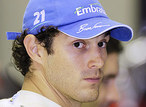 ORG XMIT: SIN169 HRT Formula One driver Bruno Senna looks around the pits at the Singapore F1 Grand Prix in this September 24, 2010 file photo. The Brazilian's Formula One career appeared to have stalled on Friday when the HRT team ruled him out of the running for their second race seat this season. REUTERS/Tim Chong/Files (SINGAPORE - Tags: HEADSHOT SPORT MOTOR RACING)