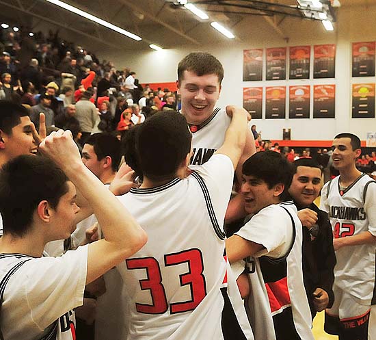 ORG XMIT: MIHOL105 Members of the Fennville High School basketball team lift Wes Leonard, top, after he made a game-winning layup in overtime against Bridgman, in Fennville, Mich. , Thursday night, March 23, 2011. After making the shot, the Michigan high school star collapsed on the court and later died. (AP Photo/The Holland Sentinel, Dennis Geppert)