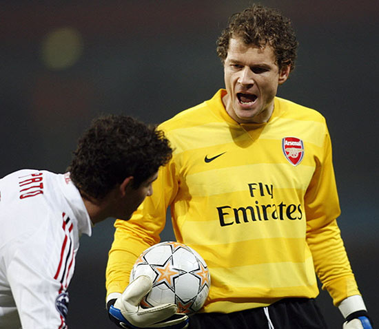 ORG XMIT: 412401_0.tif Arsenal's German goalkeeper Jens Lehmann (R) shouts at AC Milan's footballer Pato (L) after a tackle during their UEFA Champions League football match at the Emirates Stadium in north London, on February 20, 2008. AFP PHOTO/GLYN KIRK