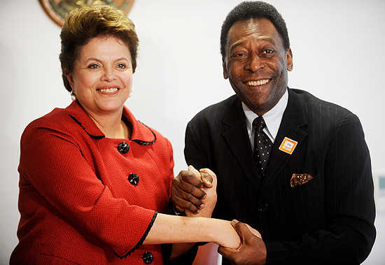 President Dilma Roussef poses for a photo beside the former player Pelé, in Brasília