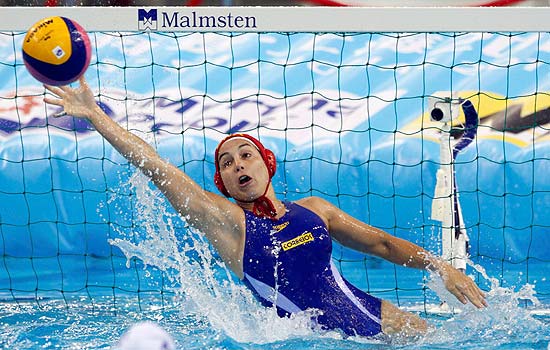 ORG XMIT: SHG457 Brazil's goalkeeper Tess Oliveira attempts a save during their preliminary round women's water polo match against Greece at the 14th FINA World Championships in Shanghai July 19, 2011. REUTERS/Issei Kato (CHINA - Tags: SPORT WATER POLO AQUATICS)