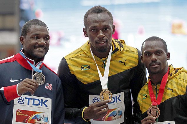 Da esq. para a dir., o americano Justin Gatlin, e os jamaicanos Usain Bolt e Nesta Carter, no pdio dos 100 m do Mundial de 2013, em Moscou