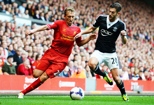 Southampton's English midfielder Adam Lallana (R) competes with Liverpool's Brazilian midfielder Lucas Leiva (L) during the English Premier League football match between Liverpool and Southampton at Anfield stadium in Liverpool, northwest England, on September 21, 2013. Southampton won 1-0. AFP PHOTO / PAUL ELLIS RESTRICTED TO EDITORIAL USE. No use with unauthorized audio, video, data, fixture lists, club/league logos or 