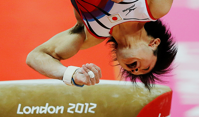 ORG XMIT: OLYSN165 Kohei Uchimura of Japan competes in the vault during the men's individual all-around gymnastics final in the North Greenwich Arena during the London 2012 Olympic Games August 1, 2012. REUTERS/Phil Noble (BRITAIN - Tags: SPORT GYMNASTICS OLYMPICS)