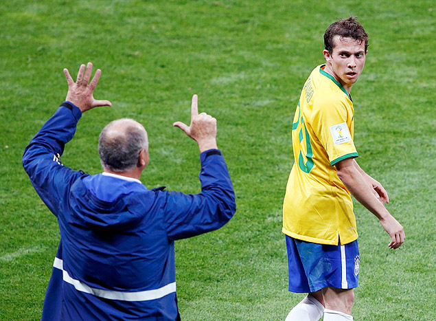 Brazil's coach Luiz Felipe Scolari gestures to Bernard during their World Cup semi-finals against Germany at the Mineirao stadium 