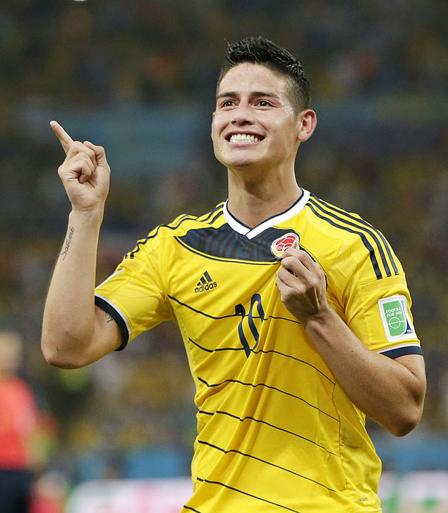 FILE - In this June 28, 2014, file photo, Colombia's James Rodriguez celebrates after he scored his side's second goal during the World Cup round of 16 soccer match between Colombia and Uruguay at the Maracana Stadium in Rio de Janeiro, Brazil. The 23-year-old Monaco forward who was the top scorer at the World Cup, is closing in on a deal with Real Madrid. Spanish sports newspapers said Monday that Monaco had agreed terms with Madrid and Rodriguez is to be presented to fans on Tuesday. (AP Photo/Marcio Jose Sanchez,File) ORG XMIT: XLAT118