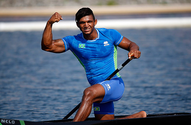 Jul 13, 2015; Welland, Ontario, CAN; Isaquias Queiroz Dos Santos of Brazil celebrates after winning the men's C1 1000m final during the 2015 Pan Am Games at Welland Pan Am Flatwater Centre. Mandatory Credit: Jeff Swinger-USA TODAY Sports ORG XMIT: USATSI-230612