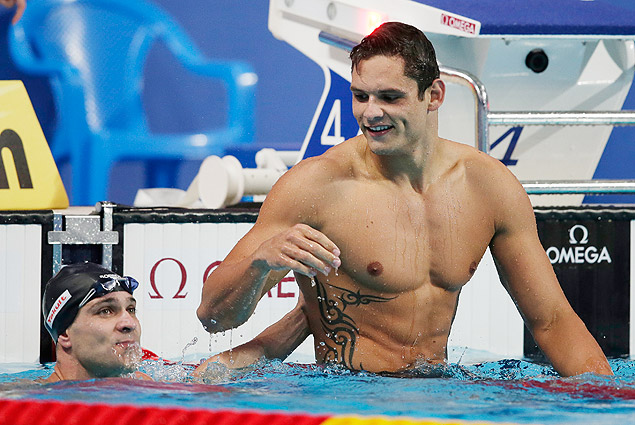 France's Florent Manaudou, right, celebrates with second placed Brazil's Nicholas Santos after the men's 50m butterfly final at the Swimming World Championships in Kazan, Russia, Monday, Aug. 3, 2015. (AP Photo/Michael Sohn) ORG XMIT: KAZ159