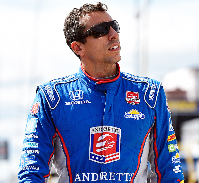 Justin Wilson, of England, walks on pit road during qualifying for Sunday's Pocono IndyCar 500 auto race, Saturday, Aug. 22, 2015, in Long Pond, Pa. Wilson was injured during Sunday's race and air lifted to the hospital. (AP Photo/Derik Hamilton) ORG XMIT: PADH107