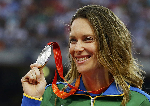 Fabiana Murer of Brazil presents her silver medal as she poses on the podium after the women's pole vault event during the 15th IAAF World Championships at the National Stadium in Beijing, China, August 27, 2015. REUTERS/Damir Sagolj ORG XMIT: SAA28