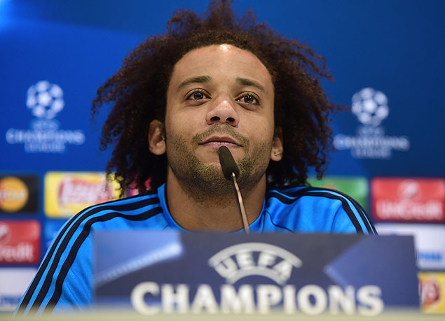 Real Madrid's Brazilian defender Marcelo listens during a press conference after a training session at Valdebebas sport city in Madrid on November 2, 2015 on the eve of their Champions' League football match against Paris Saint Germain. AFP PHOTO/ PIERRE-PHILIPPE MARCOU ORG XMIT: PPM872