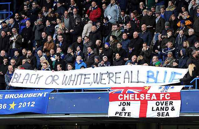 Chelsea fans hold an anti-racism banner during the English Premier League football match between Chelsea and Burnley at Stamford Bridge in London on February 21, 2015. AFP PHOTO / OLLY GREENWOOD RESTRICTED TO EDITORIAL USE. NO USE WITH UNAUTHORIZED AUDIO, VIDEO, DATA, FIXTURE LISTS, CLUB/LEAGUE LOGOS OR 