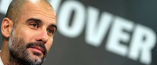 Munich head coach pep Guardiola, attends a press conference after the German Bundesliga soccer match between Hannover 96 and FC Bayern Munich in Hannover, Germany, Saturday, Dec. 19, 2015. Munich defeated Hannover by 1-0. (AP Photo/Michael Sohn) ORG XMIT: SOB120