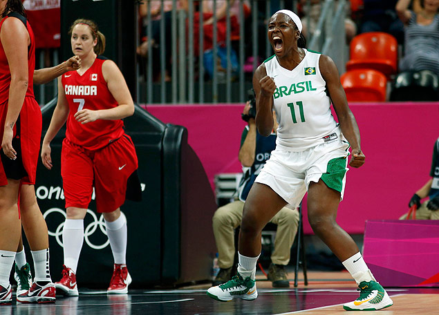 ORG XMIT: OLYIM11 Brazil's Clarissa Santos (R) reacts to making the final basket at the end of the third quarter against Canada during their women's preliminary round Group B basketball match at the Basketball Arena during the London 2012 Olympic Games August 3, 2012. REUTERS/Mike Segar (BRITAIN - Tags: OLYMPICS SPORT BASKETBALL)
