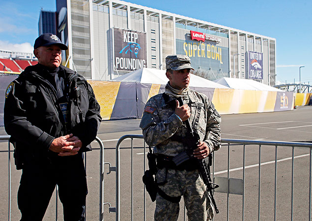 Feb 2, 2016; Santa Clara, CA, USA; Santa Clara police officer Tom Damsen and U.S. Army National Guard member Henry Marquez guard a security check point prior to Super Bowl 50 between the Denver Broncos and the Carolina Panthers at Levi's Stadium. Mandatory Credit: Peter Casey-USA TODAY Sports