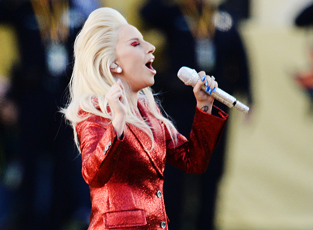 Feb 7, 2016; Santa Clara, CA, USA; Recording artist Lady Gaga performs the national anthem before Super Bowl 50 between the Carolina Panthers and the Denver Broncos at Levi's Stadium. Mandatory Credit: Robert Hanashiro-USA TODAY Sports ORG XMIT: USATSI-245820