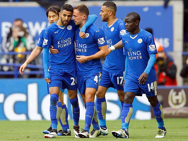 Football Soccer - Leicester City v Swansea City - Barclays Premier League - The King Power Stadium - 15/16 - 24/4/16 Riyad Mahrez celebrates with team mates after scoring the first goal for Leicester Reuters / Darren Staples EDITORIAL USE ONLY. No use with unauthorized audio, video, data, fixture lists, club/league logos or "live" services. Online in-match use limited to 45 images, no video emulation. No use in betting, games or single club/league/player publications. Please contact your account representative for further details. ORG XMIT: UKYg5O
