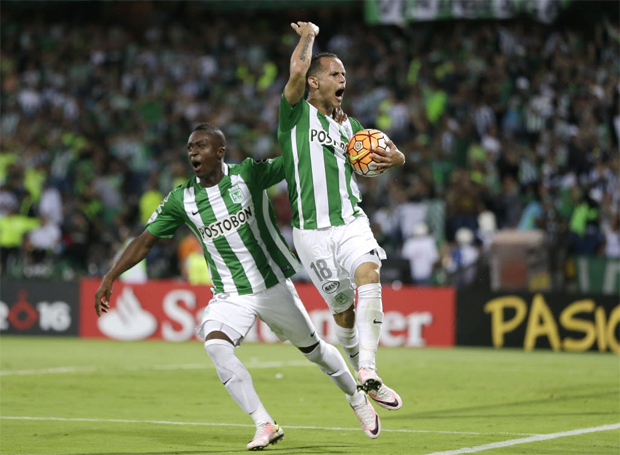 Alejandro Guerra of Colombia's Atletico Nacional, right, celebrates with teammate Marlos Moreno scoring his side's 2nd goal against Argentina's Rosario Central during a Copa Libertadores quarter final second leg soccer match in Medellin, Colombia, Thursday, May 19, 2016. (AP Photo/Ricardo Mazalan) ORG XMIT: XRM109