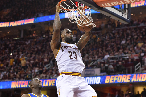 Jun 8, 2016; Cleveland, OH, USA; Cleveland Cavaliers forward LeBron James (23) dunks the ball in front of Golden State Warriors forward Draymond Green (23) during the four quarter in game three of the NBA Finals at Quicken Loans Arena. Mandatory Credit: Ken Blaze-USA TODAY Sports ORG XMIT: USATSI-269458