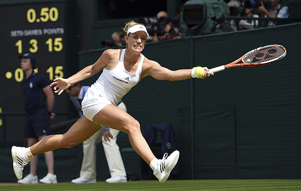 Angelique Kerber of Germany returns to Venus Williams of the U.S during their women's singles match on day eleven of the Wimbledon Tennis Championships in London, Thursday, July 7, 2016. (Gerry Penny/Pool Photo via AP) ORG XMIT: WIM276