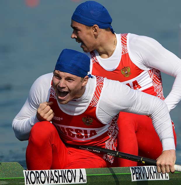 (FILES) This file photo taken on August 09, 2012 shows Russia's Alexey Korovashkov (L) and Ilya Pervukhin celebrating after winning the bronze medal in the canoe double (C2) 1000m men's final A during the London 2012 Olympic Games, at Eton Dorney Rowing Centre in Eton, west of London. Canoeing's governing body has banned five Russians, including a gold medallist and a five-times world champion, from next month's Rio Olympics after an explosive independent report revealed state-run doping across Russian sport. The five were named as Elena Aniushina, Natalia Podolskaya, Alexander Dyachenko, Andrey Kraitor and Alexey Korovashkov. / AFP PHOTO / POOL / FRANCISCO LEONG ORG XMIT: MSN280
