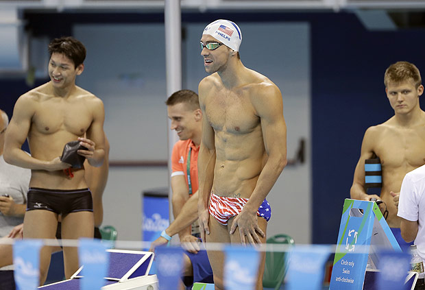 United States' Michael Phelps, center, prepares a swimming training session at the 2016 Summer Olympics in Rio de Janeiro, Brazil, Tuesday, Aug. 2, 2016. (AP Photo/Matt Slocum) ORG XMIT: OSWM131
