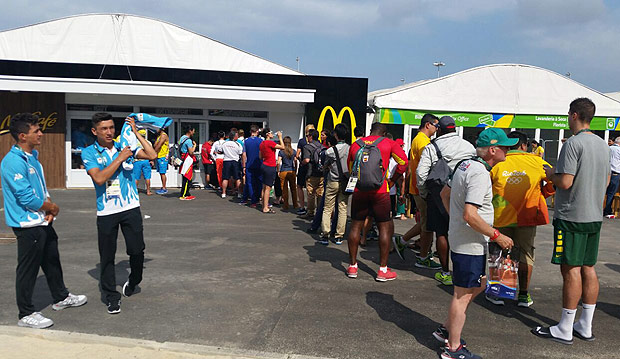 Frantic consumer traffic overwhelms the McDonald's located in the Olympic Village in the international zone