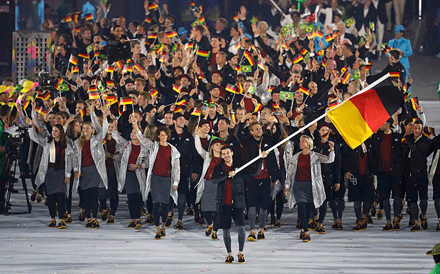 2016 Rio Olympics - Opening ceremony - Maracana - Rio de Janeiro, Brazil - 05/08/2016. Flagbearer Timo Boll (GER) of Germany leads his contingent during the opening ceremony. REUTERS/Stoyan Nenov FOR EDITORIAL USE ONLY. NOT FOR SALE FOR MARKETING OR ADVERTISING CAMPAIGNS. ORG XMIT: AA31