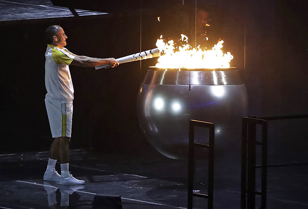 Vanderlei de Lima lights the Olympic flame during the opening ceremony for the 2016 Summer Olympics in Rio de Janeiro, Brazil, Friday, Aug. 5, 2016. (AP Photo/Jae C. Hong) ORG XMIT: Vanderlei Cordeiro de Lima