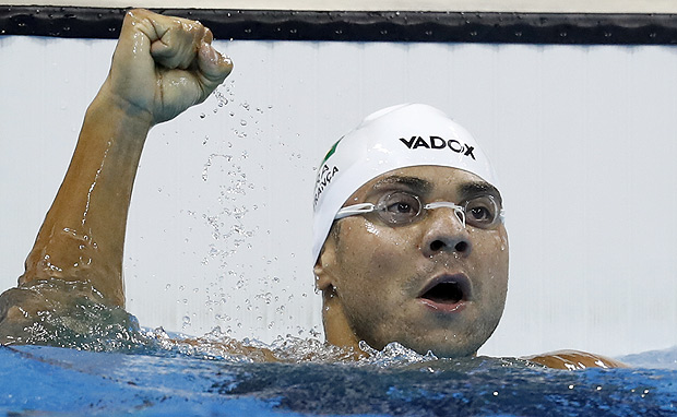 Brazil's Felipe Franca reacts after taking part in the Men's 100m Breaststroke heat during the swimming event at the Rio 2016 Olympic Games at the Olympic Aquatics Stadium in Rio de Janeiro on August 6, 2016. / AFP PHOTO / Odd Andersen