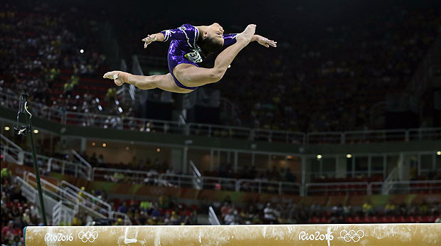 Brazil's Flavia Saraiva performs on the balance beam during the artistic gymnastics women's qualification at the 2016 Summer Olympics in Rio de Janeiro, Brazil, Sunday, Aug. 7, 2016. (AP Photo/Rebecca Blackwell) ORG XMIT: OGYM295
