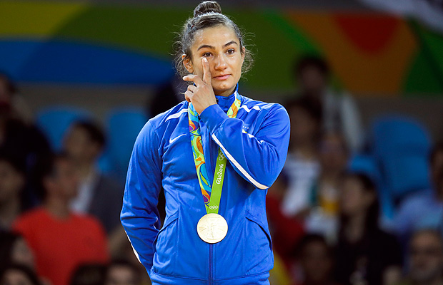 Kosovo's Majlinda Kelmendi receives the gold medal after winning the women's 52-kg judo competition at the 2016 Summer Olympics in Rio de Janeiro, Brazil, Sunday, Aug. 7, 2016. (AP Photo/Markus Schreiber) ORG XMIT: OJUD153