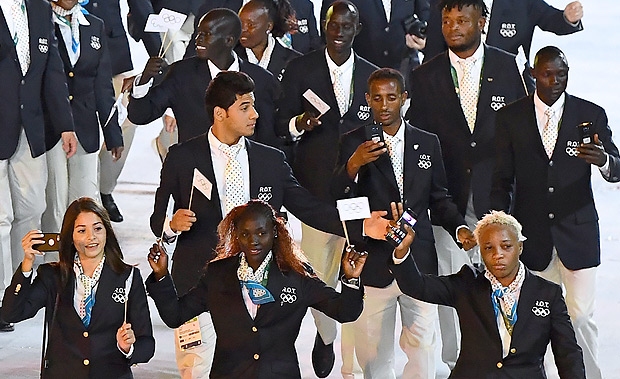The Refugee Olympic team members take part in the opening ceremony of the Rio 2016 Olympic Games at the Maracana stadium in Rio de Janeiro on August 5, 2016. / AFP PHOTO / FRANCK FIFE