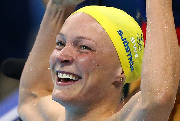 2016 Rio Olympics - Swimming - Final - Women's 100m Butterfly Final - Olympic Aquatics Stadium - Rio de Janeiro, Brazil - 07/08/2016. Sarah Sjostrom (SWE) of Sweden celebreates after setting a new world record. REUTERS/Michael Dalder FOR EDITORIAL USE ONLY. NOT FOR SALE FOR MARKETING OR ADVERTISING CAMPAIGNS. ORG XMIT: VP106
