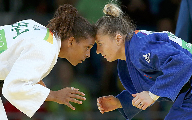 2016 Rio Olympics - Judo - Semifinal - Women -57 kg Semifinal Contests - Carioca Arena 2 - Rio de Janeiro, Brazil - 08/08/2016. Rafaela Silva (BRA) of Brazil and Corina Caprioriu (ROU) of Romania compete. REUTERS/Toru Hanai TPX IMAGES OF THE DAY. FOR EDITORIAL USE ONLY. NOT FOR SALE FOR MARKETING OR ADVERTISING CAMPAIGNS. ORG XMIT: ALP96