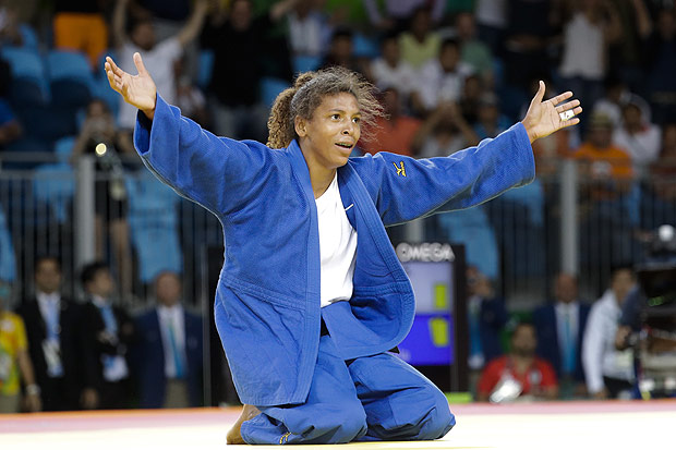 Brazil's Rafaela Silva celebrates after winning the gold medal of the women's 57-kg judo competition at the 2016 Summer Olympics in Rio de Janeiro, Brazil, Monday, Aug. 8, 2016. (AP Photo/Markus Schreiber) ORG XMIT: OJUD133