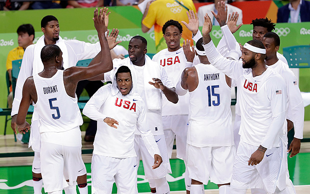 United States' Kevin Durant (5) celebrates with teammates during a basketball game against Venezuela at the 2016 Summer Olympics in Rio de Janeiro, Brazil, Monday, Aug. 8, 2016. (AP Photo/Charlie Neibergall) ORG XMIT: OBKO124