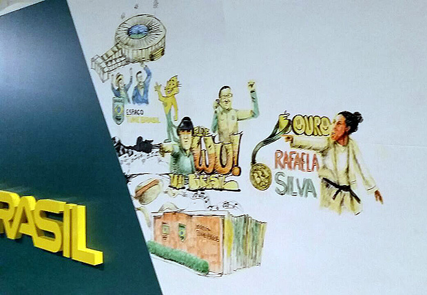 O ilustrador e grafiteiro Caz conclui o desenho da judoca Rafaela Silva, medalhista de ouro, num.painel na casa do Time Brasil. Ele faz uma ilustrao com o tema de cada dia.