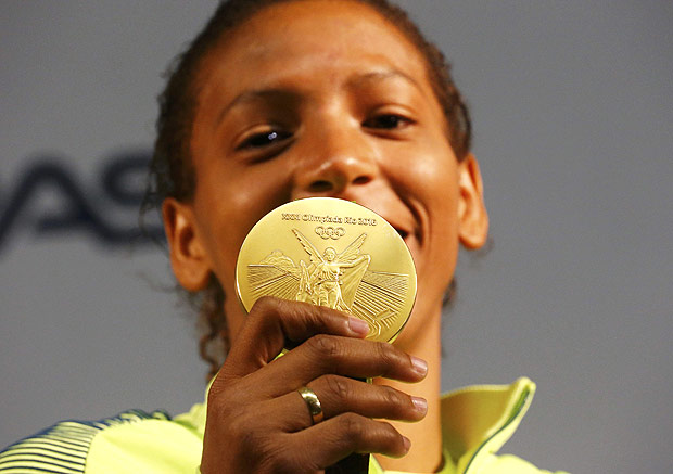 Rafaela Silva holds her gold medal during a press conference